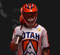 Tom Schreiber, in a Utah Archers uniform, Wearing lacrosse equipment for a photo shoot